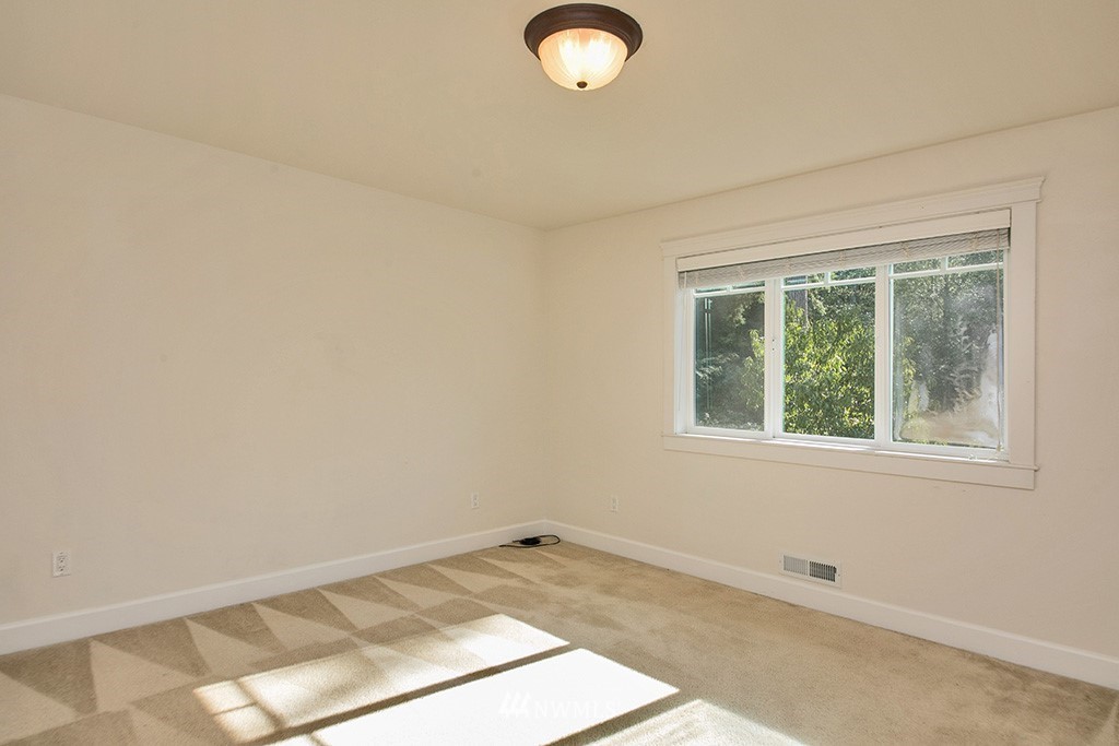 1822 East Watkins Road Freeland, WA 98249 - Photo 17 of 25 an empty room with a window