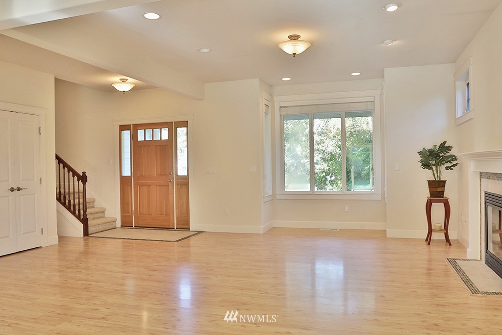 1822 East Watkins Road Freeland, WA 98249 - Photo 4 of 25 a view of empty room with wooden floor and fan