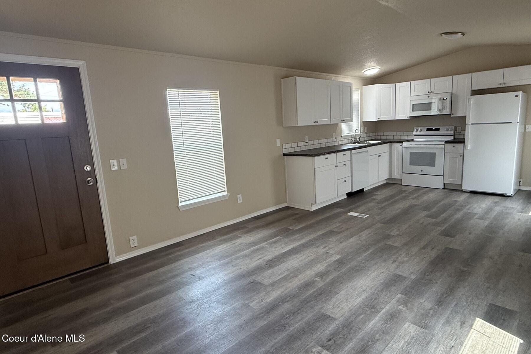 10734 North Benoit Street Hayden, ID 83835 - Photo 7 of 21 Living Room to Kitchen