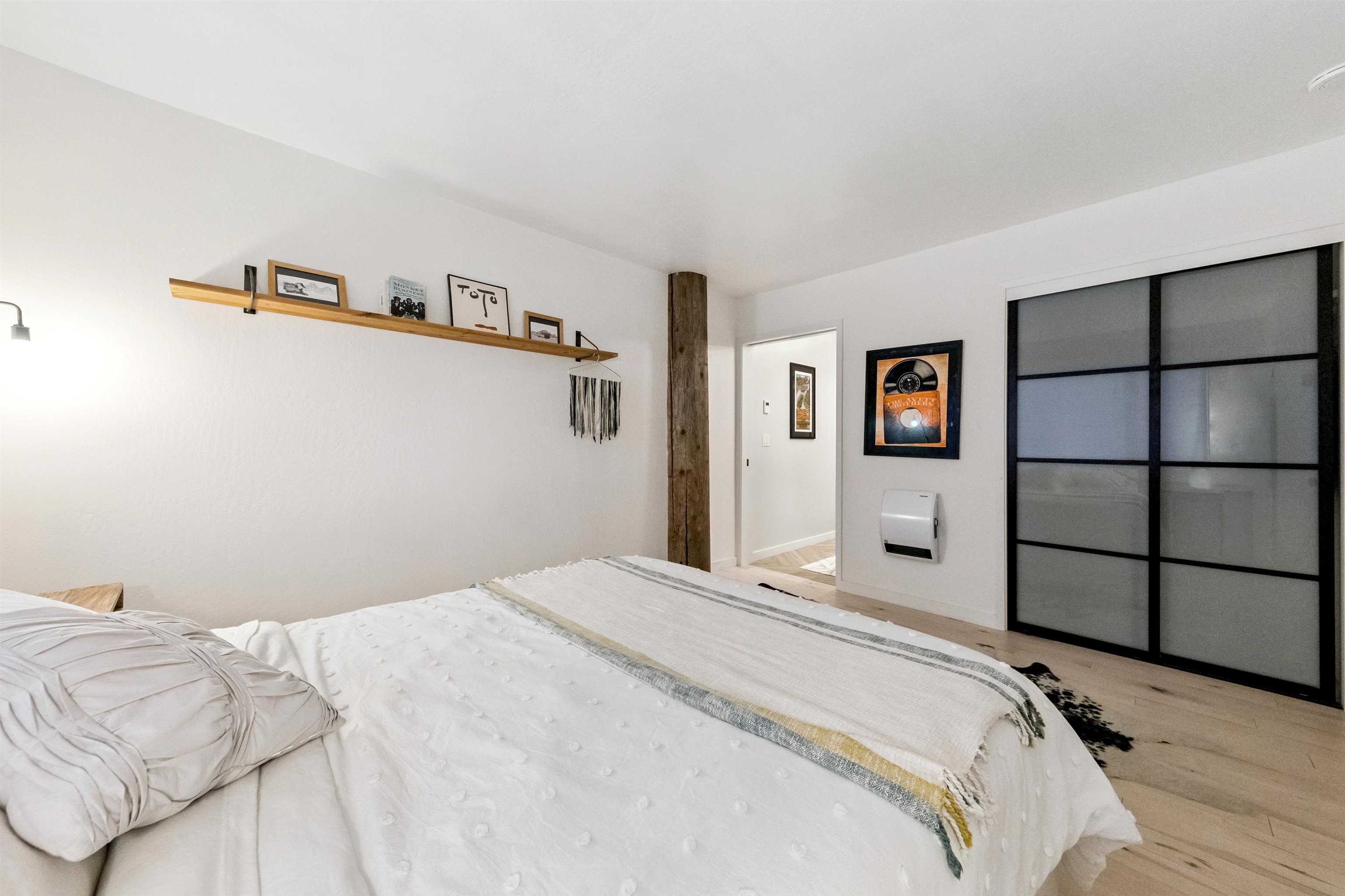 a bedroom with a bed and a cabinets
