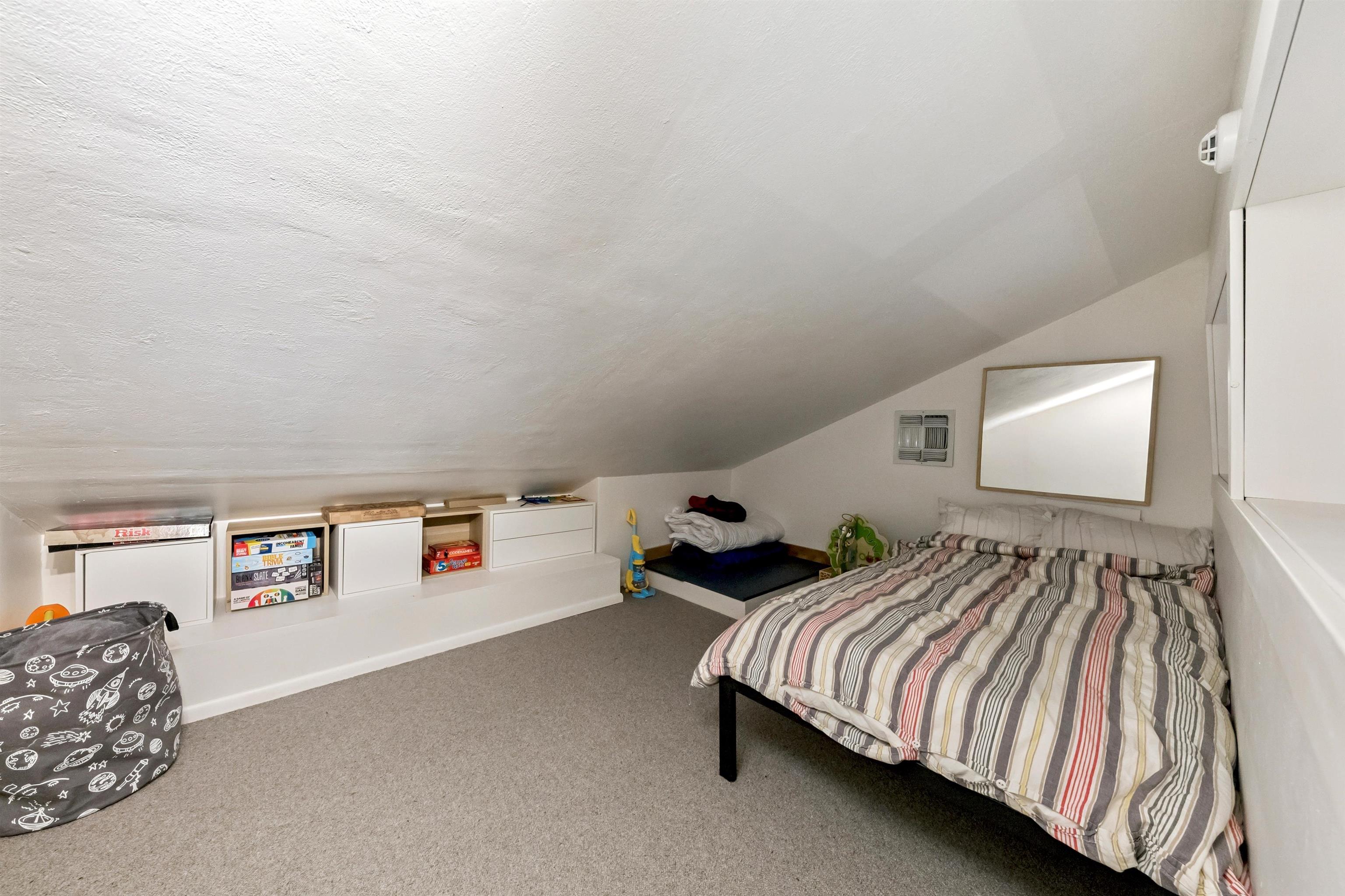 15462 Donner Pass Road, Unit 30 Truckee, CA 96161 - Photo 15 of 28 a bedroom with a bed and lamp