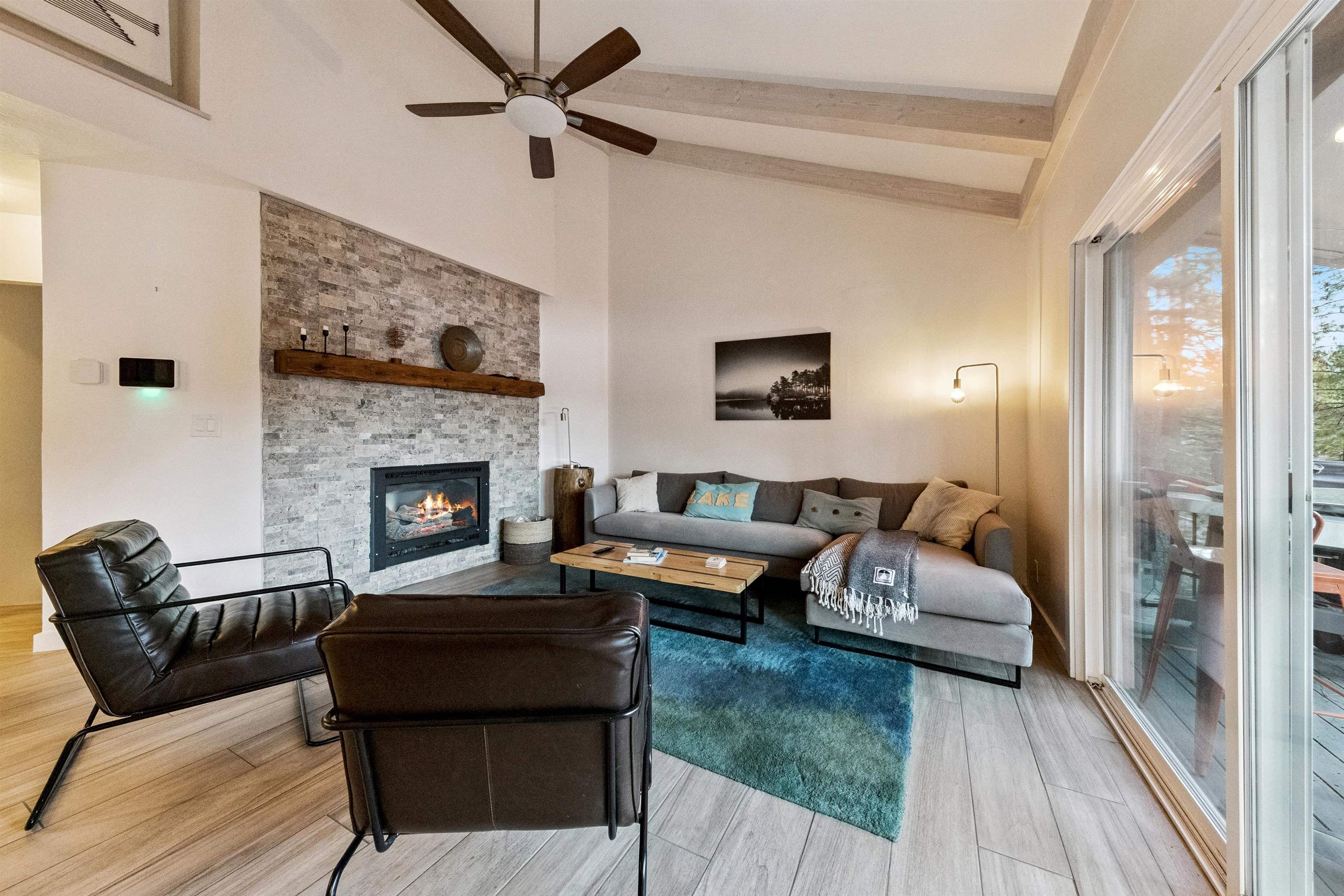 15462 Donner Pass Road, Unit 30 Truckee, CA 96161 - Photo 22 of 28 a living room with furniture and a fireplace