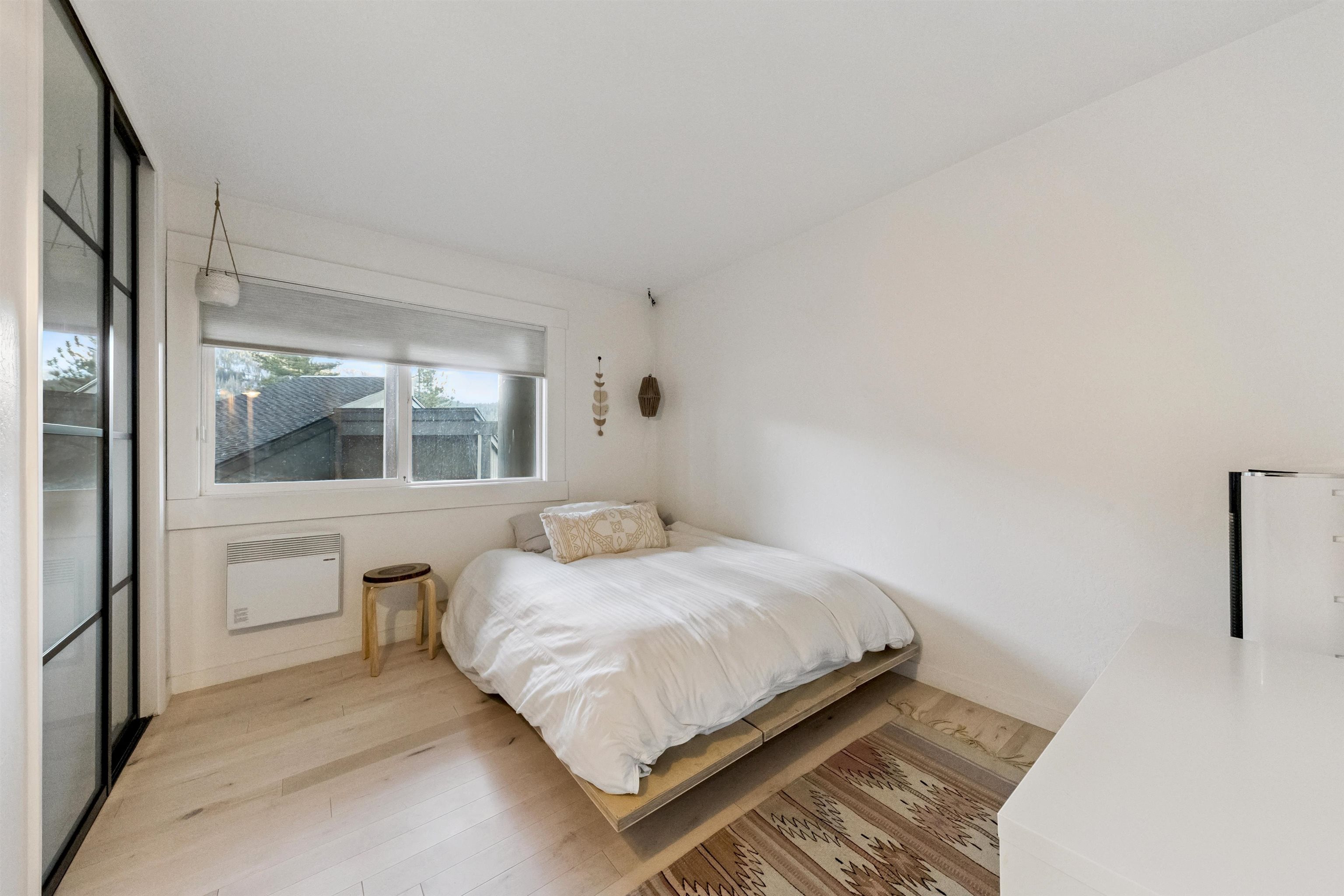 15462 Donner Pass Road, Unit 30 Truckee, CA 96161 - Photo 6 of 28 a bedroom with a bed and a window