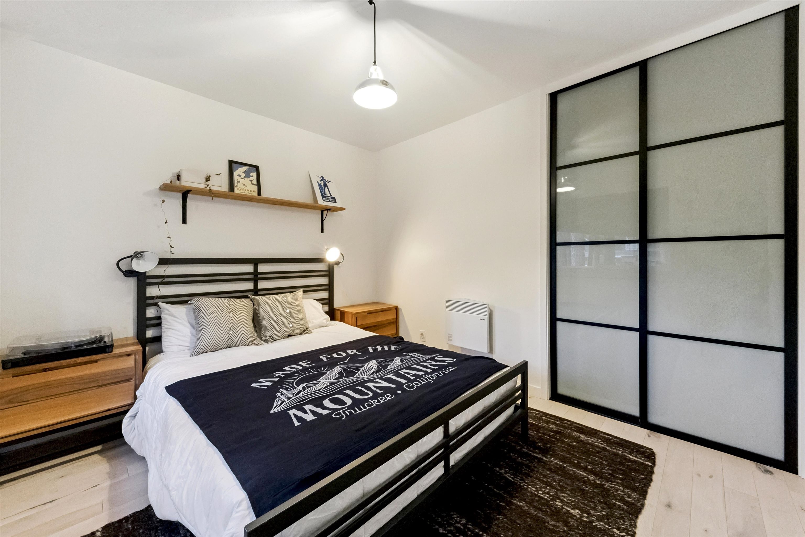 15462 Donner Pass Road, Unit 30 Truckee, CA 96161 - Photo 9 of 28 a bed sitting in a bedroom next to a window