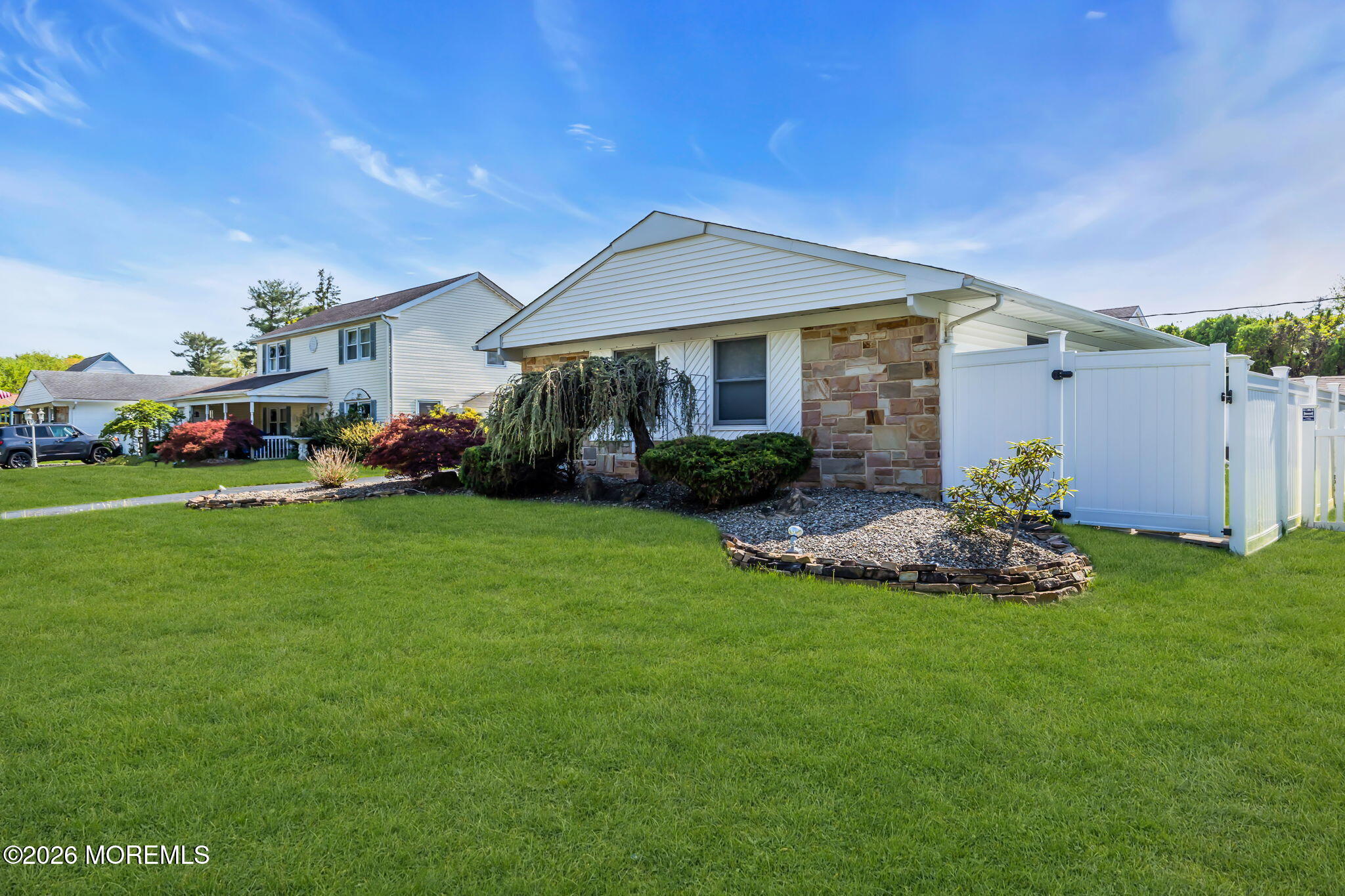 101 Andover Lane Matawan, NJ 07747 - Photo 3 of 51 a front view of a house with a garden and plants
