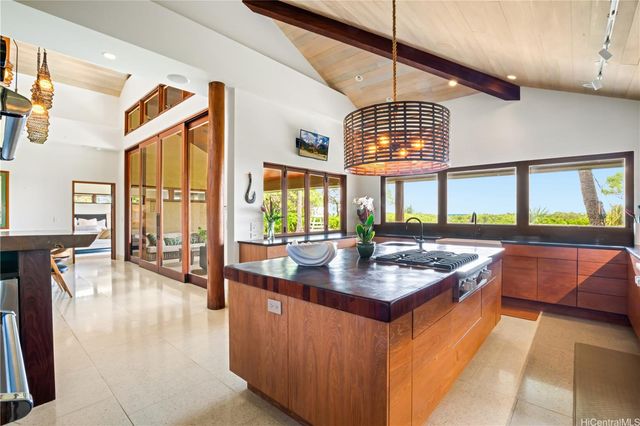 a very nice looking kitchen with a large window