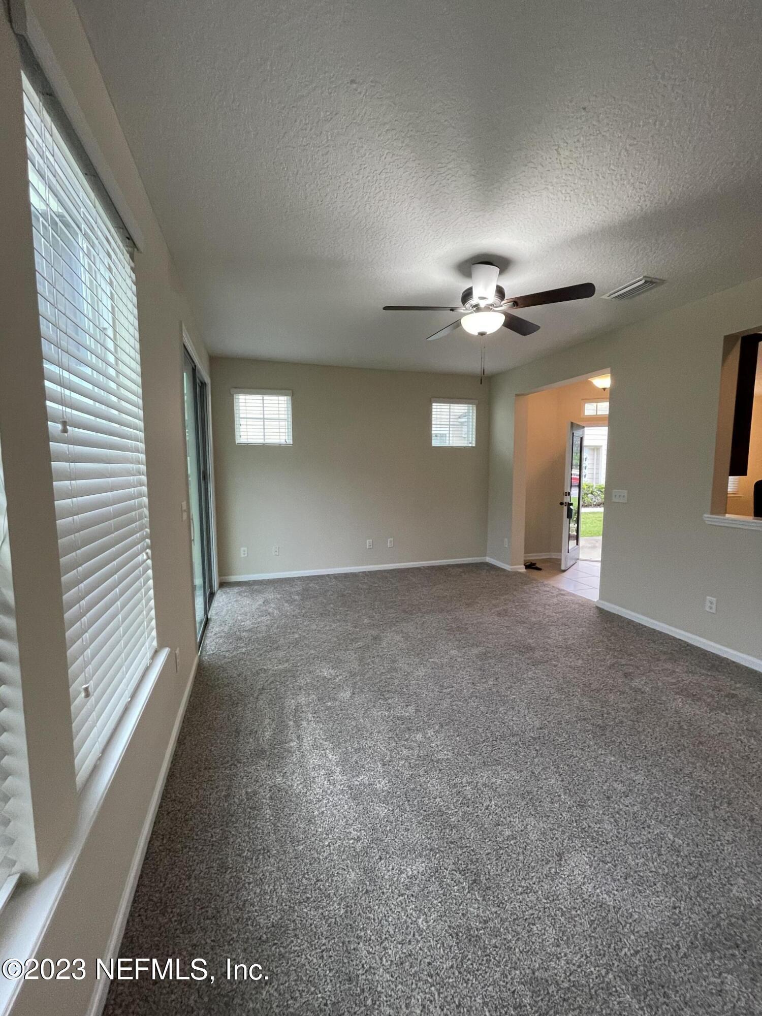 41 Nelson Lane St. Johns, FL 32259 - Photo 3 of 18 a view of a livingroom with a ceiling fan and window
