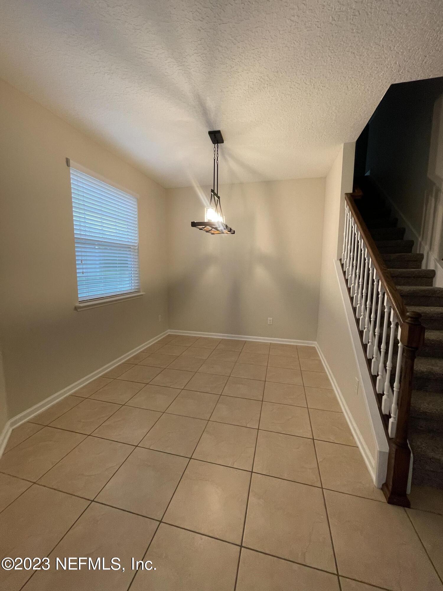 41 Nelson Lane St. Johns, FL 32259 - Photo 4 of 18 a view of a livingroom with a staircase