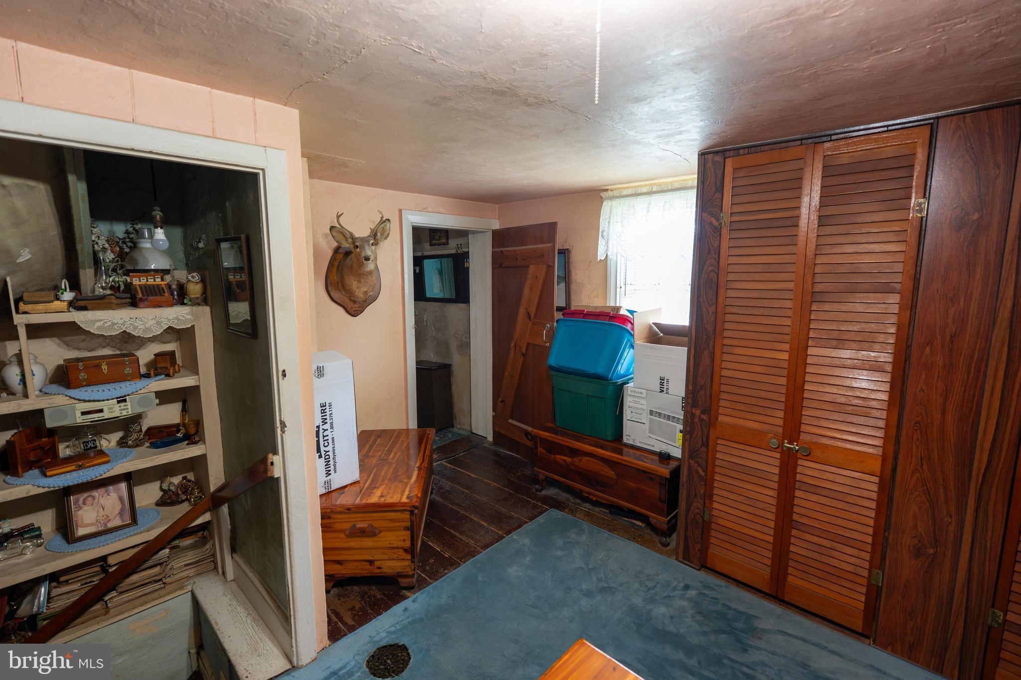 4520 Newark Road Cochranville, PA 19330 - Photo 11 of 24 a living room with furniture a flat screen tv and a walk in closet