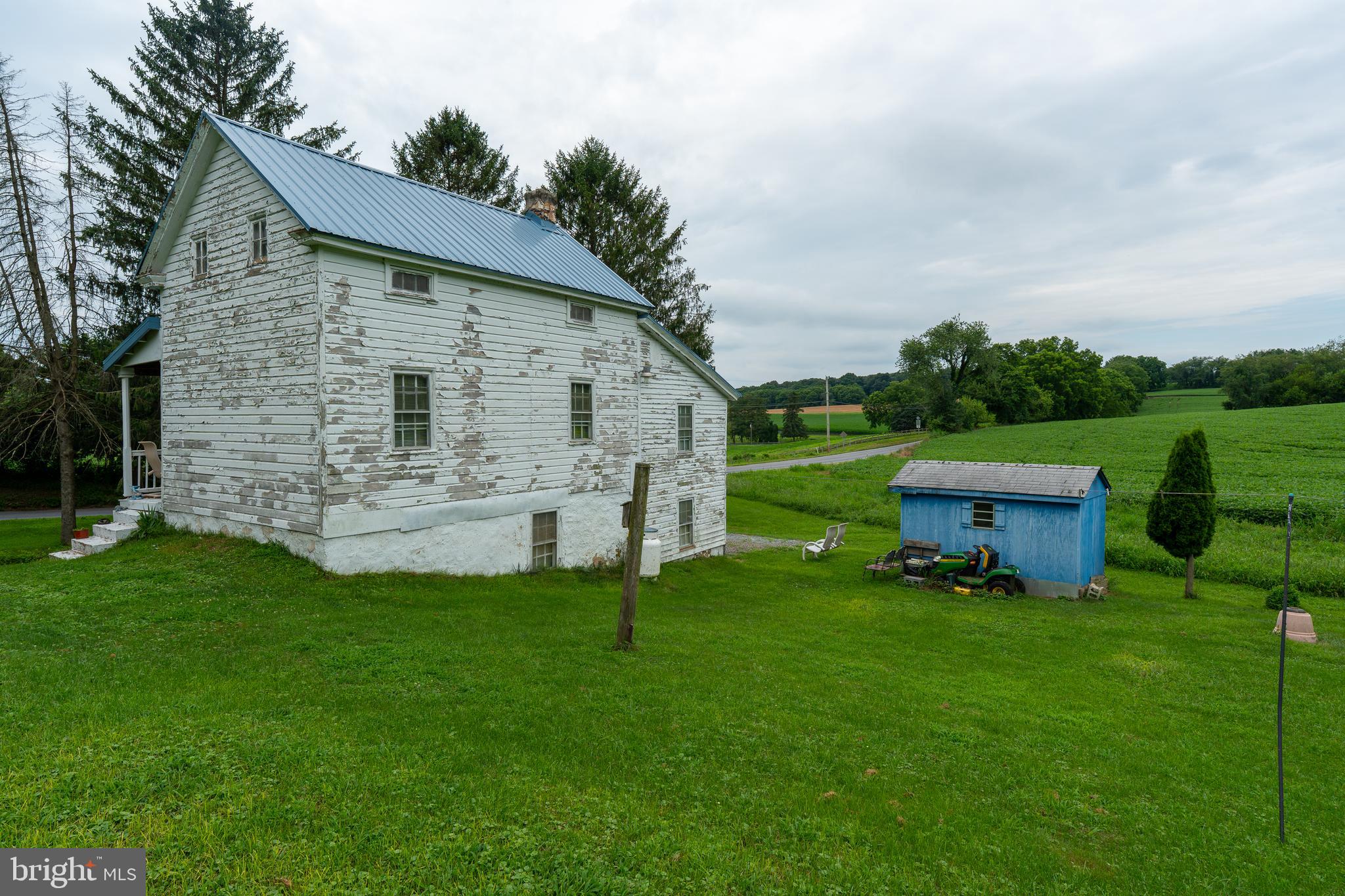 4520 Newark Road Cochranville, PA 19330 - Photo 17 of 24 a front view of a house with garden