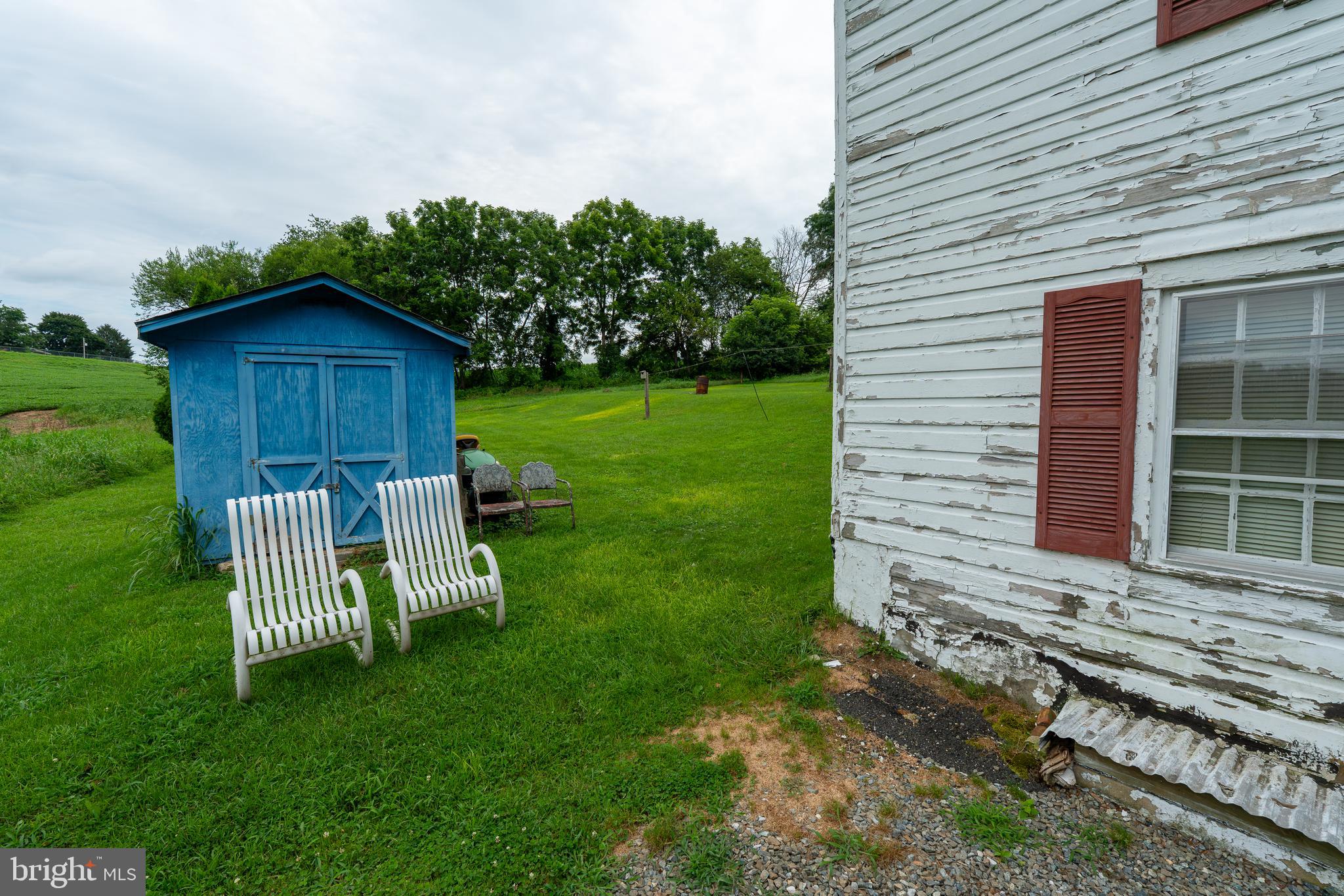 4520 Newark Road Cochranville, PA 19330 - Photo 19 of 24 a view of a wooden bench sitting in backyard of house