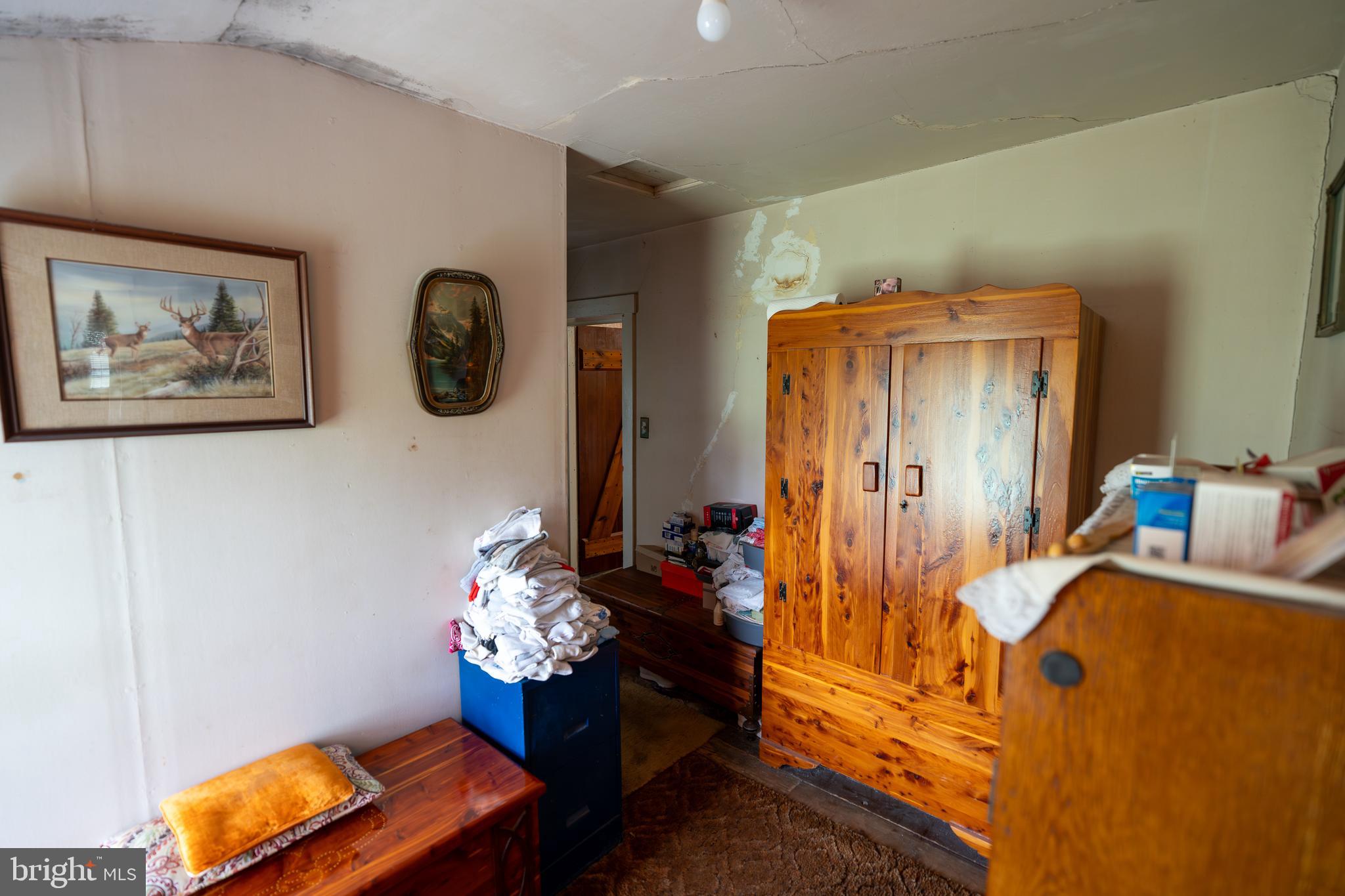 4520 Newark Road Cochranville, PA 19330 - Photo 8 of 24 a bedroom with a bed and a chandelier