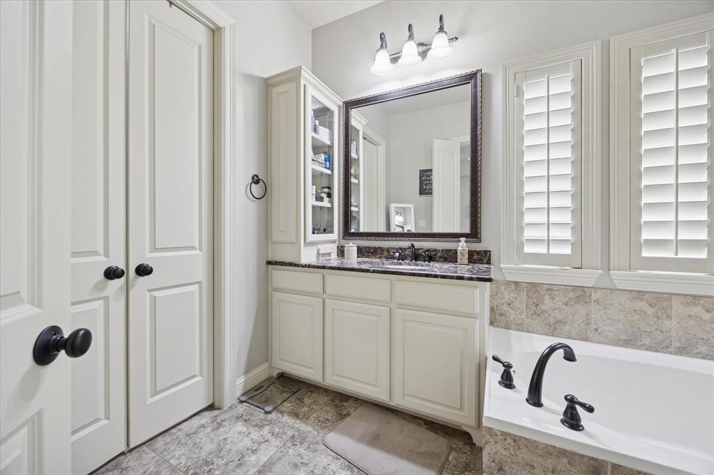 580 Butchart Drive Prosper, TX 75078 - Photo 19 of 40 Full bathroom featuring a garden tub and vanity