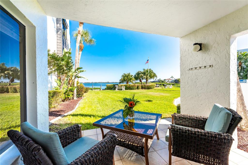 2955 North Beach Road, Unit A415 Englewood, FL 34223 - Photo 1 of 1 a living room with furniture and a pool