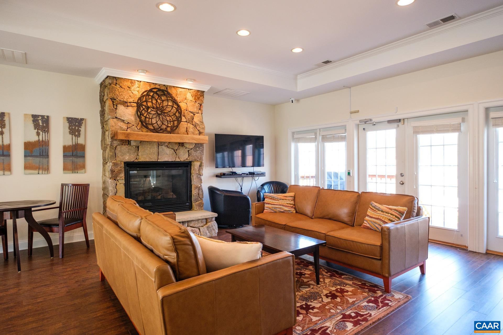 2720 Avinity Lane Charlottesville, VA 22902 - Photo 29 of 45 a living room with furniture and a fireplace