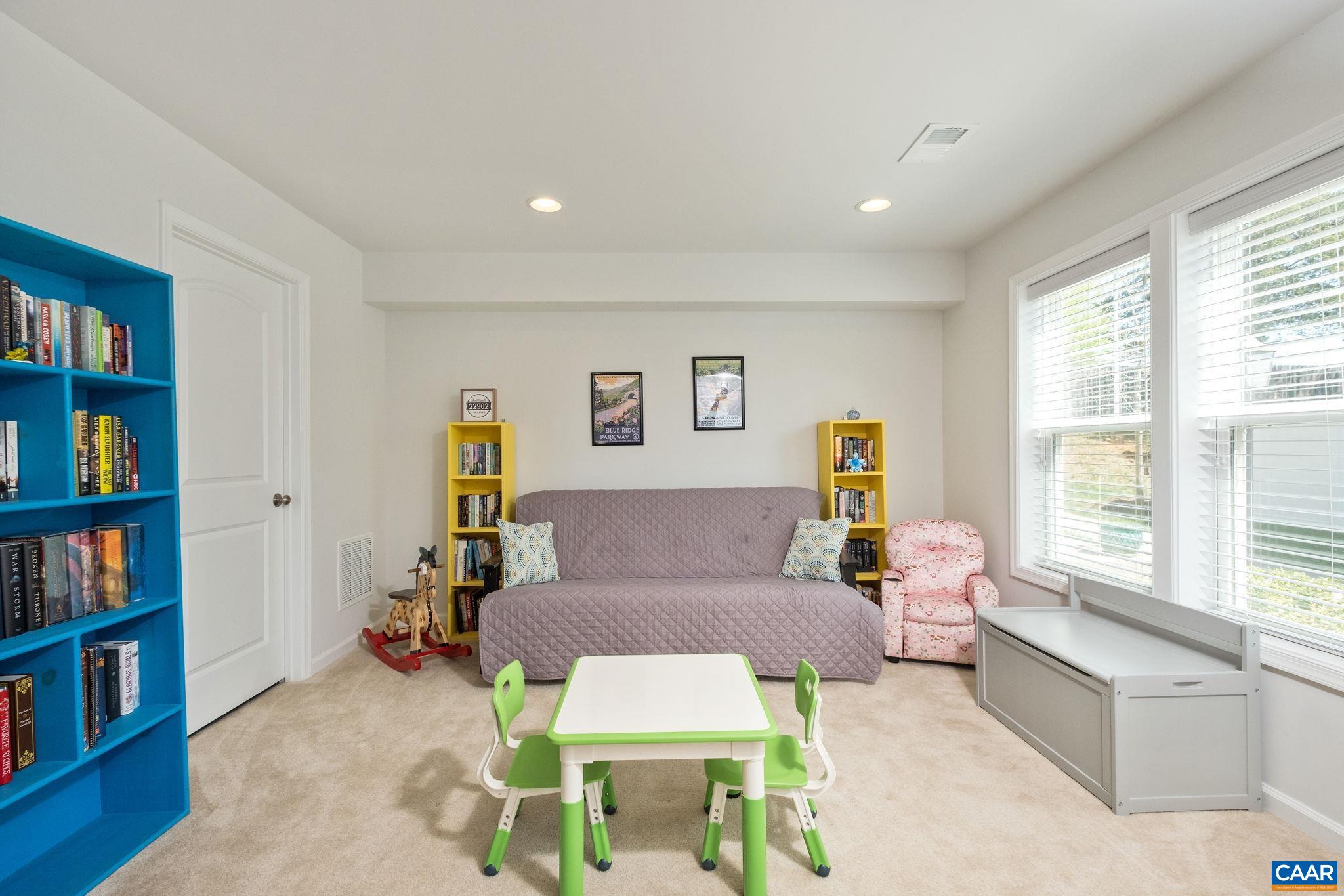 2720 Avinity Lane Charlottesville, VA 22902 - Photo 5 of 45 a living room with furniture and a book shelf