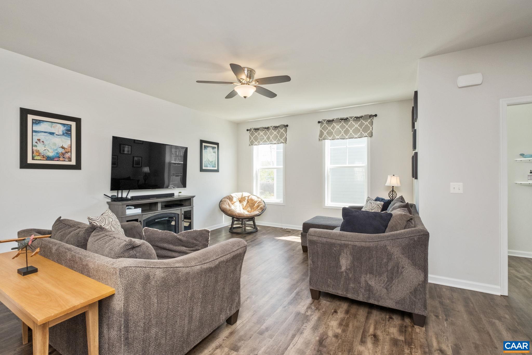 2720 Avinity Lane Charlottesville, VA 22902 - Photo 10 of 45 a living room with furniture and a flat screen tv
