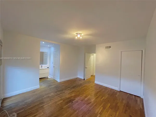 a view of entryway with wooden floor