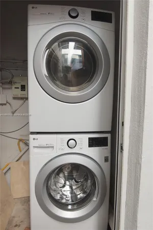 a house with potted plants in front of it