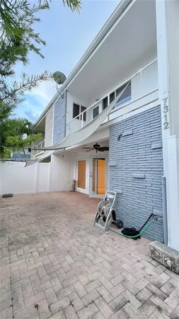 a view of a house with a tree