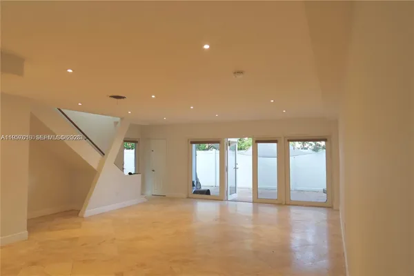 a stove top oven sitting inside of a kitchen