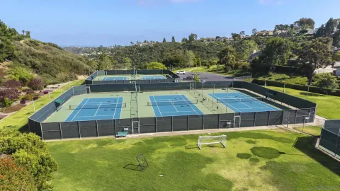 an aerial view of a house with a swimming pool