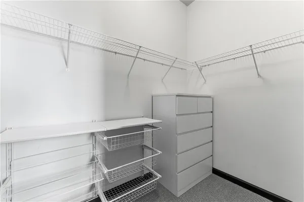 a view of a room with racks on the wall