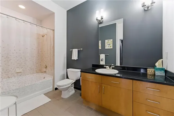 a bath room with a sink and a mirror