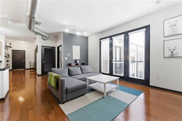 a living room with furniture and a window