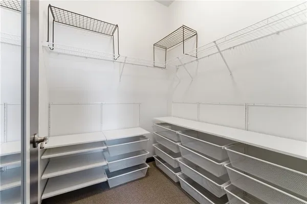 a view of room with racks on the wall