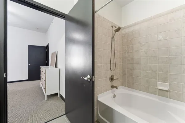 a bathroom with a bathtub and a shower