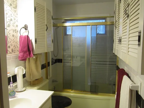 a bathroom with a sink and a shower