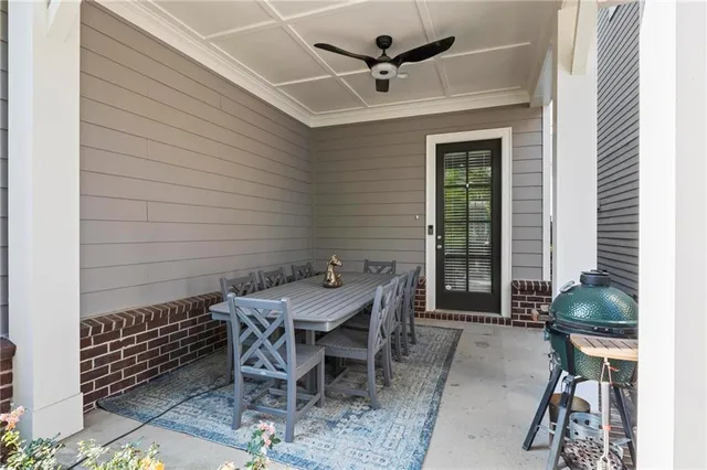 a view of a patio with a table and chairs