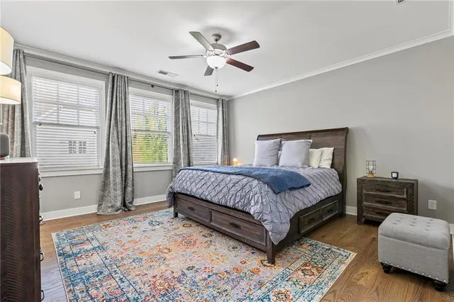 a bedroom with a bed couch and window