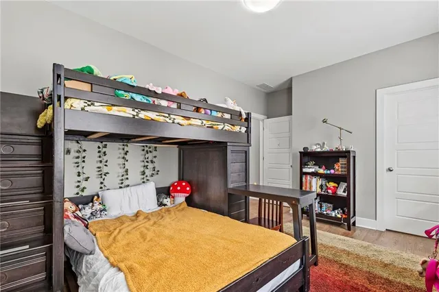 a bedroom with a bed and a tv in it