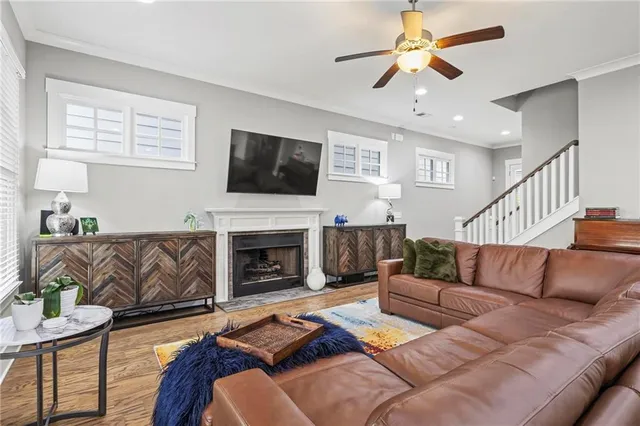 a living room with furniture fireplace and a flat screen tv