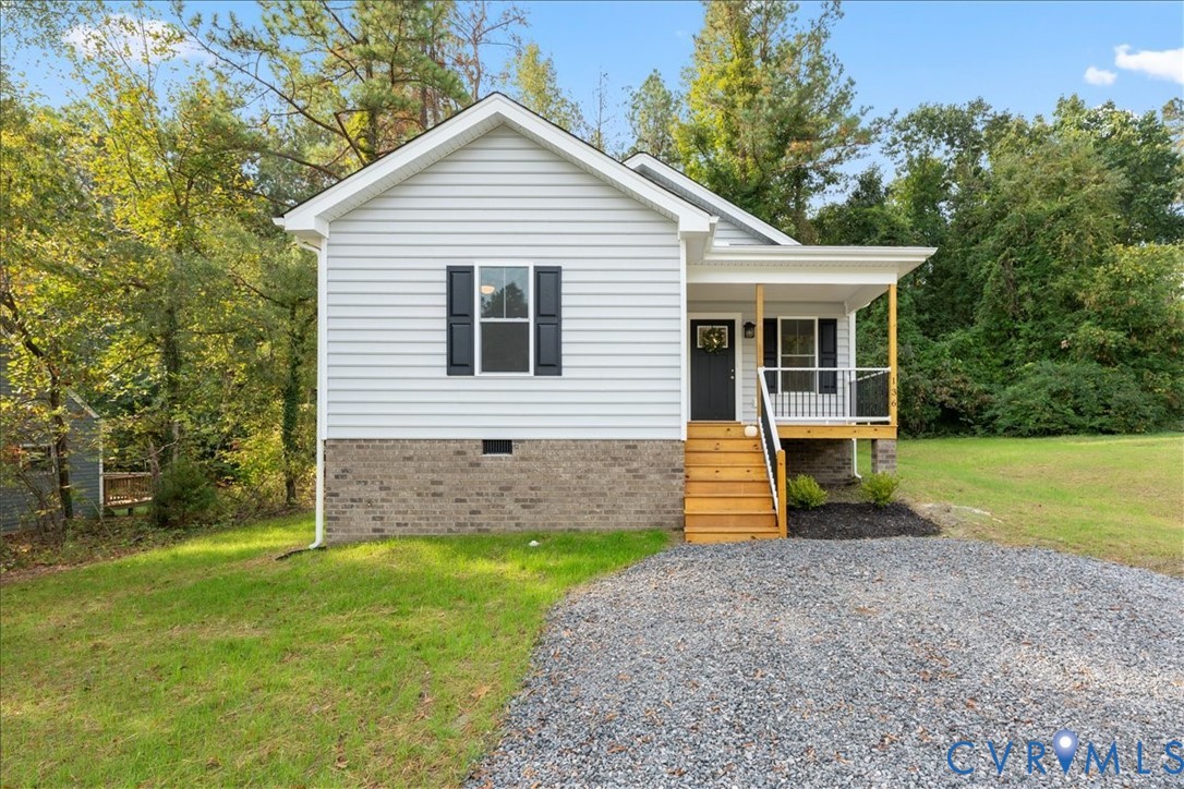 136 Gene Road Blackstone, VA 23824 - Photo 1 of 18 View of front of house featuring a front lawn, a p