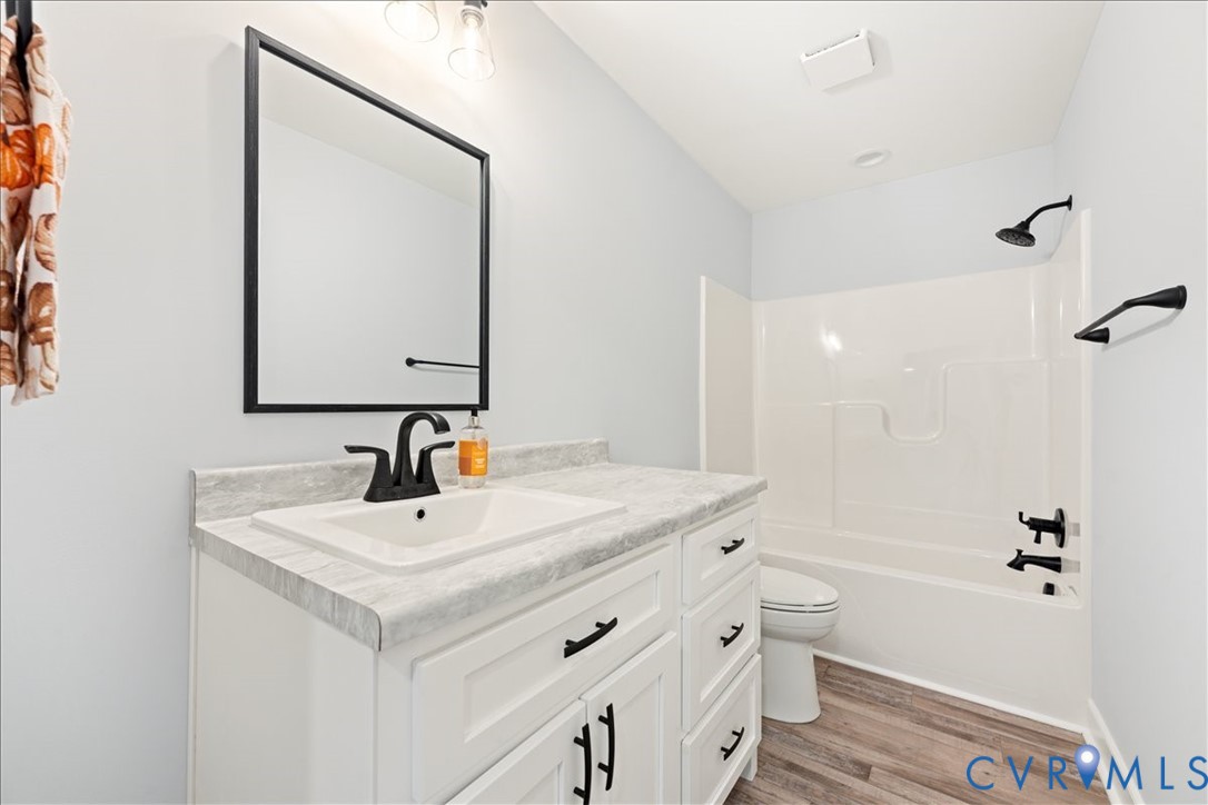 136 Gene Road Blackstone, VA 23824 - Photo 14 of 18 Bathroom featuring vanity, light wood-style floors
