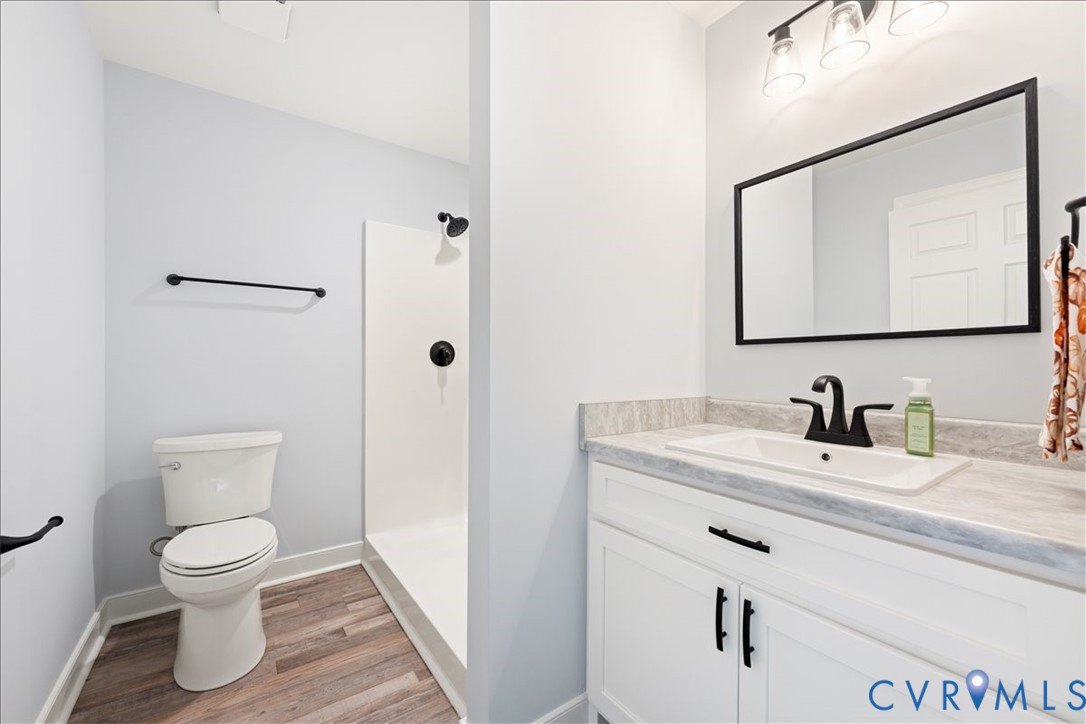 136 Gene Road Blackstone, VA 23824 - Photo 9 of 18 Bathroom with vanity, light wood-type flooring, an