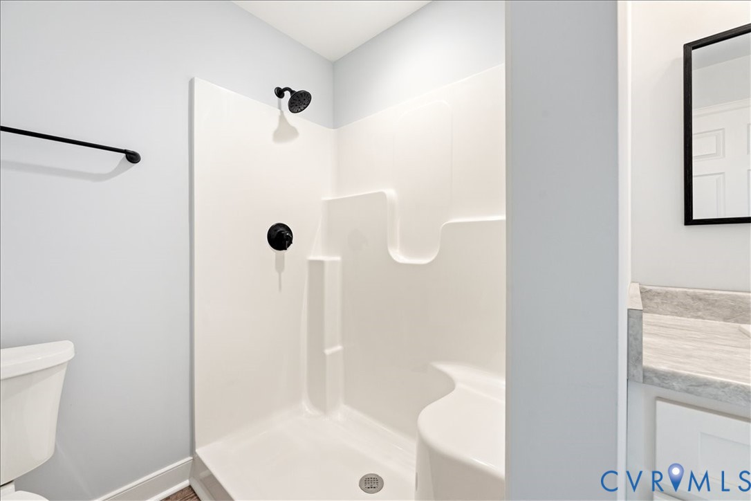 136 Gene Road Blackstone, VA 23824 - Photo 10 of 18 Bathroom with vanity and a shower