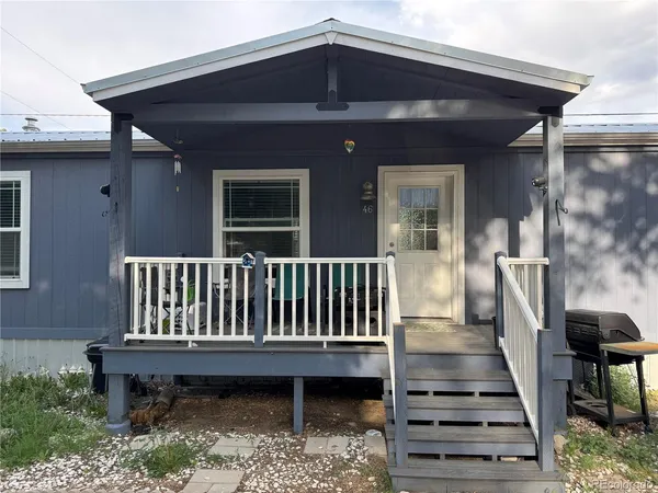 a view of a deck with a table and chairs