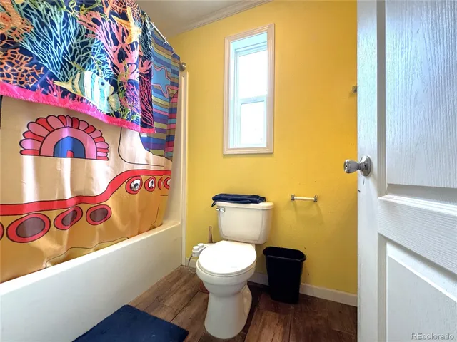 a bathroom with a toilet and a sink