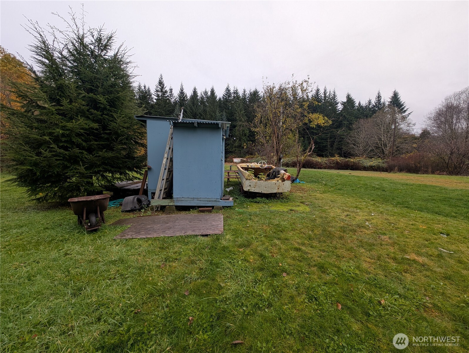 81 Barber Road Clallam Bay, WA 98326 - Photo 20 of 30 a view of a house with backyard and sitting area