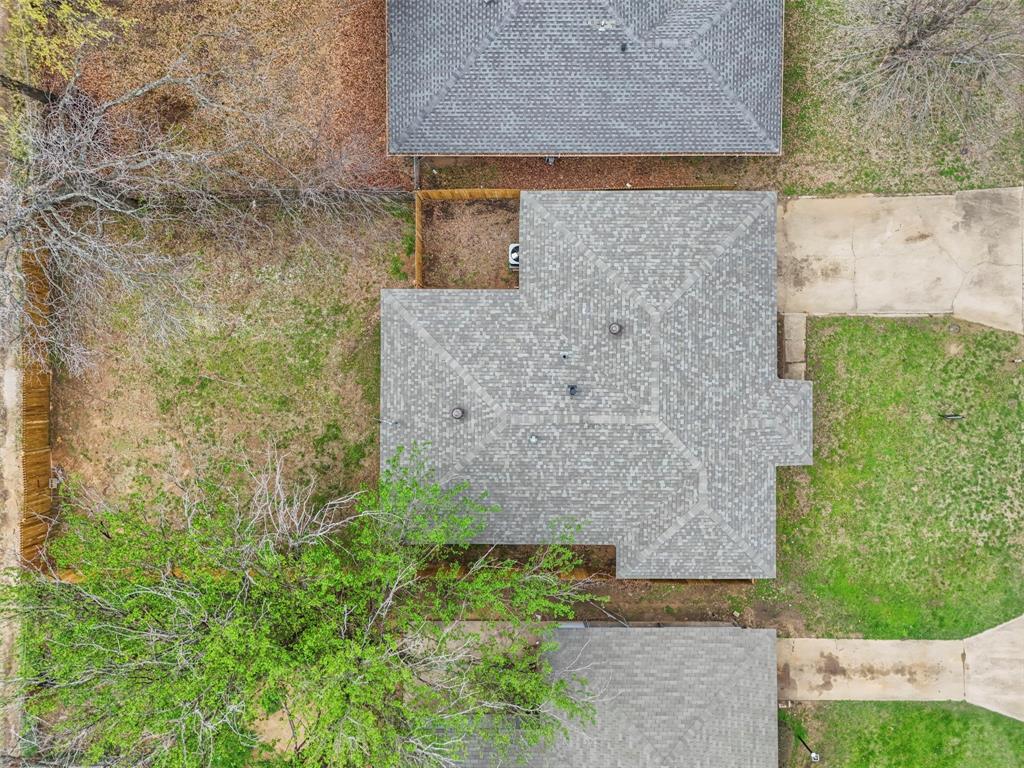 732 Bullock Street Denison, TX 75020 - Photo 28 of 29 a brick building with a yard