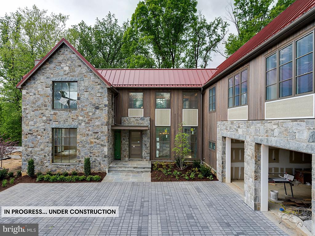 7027 Longwood Drive Bethesda, MD 20817 - Photo 1 of 7 a front view of a house with a garden