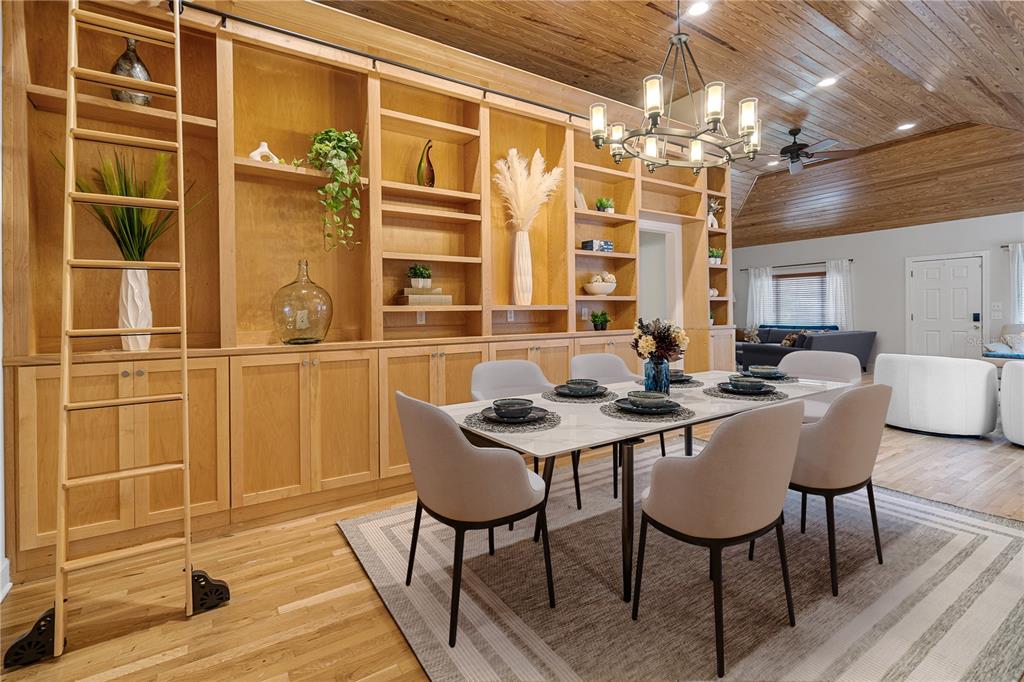 1017 Northeast 3rd Avenue Gainesville, FL 32601 - Photo 1 of 27 a view of a dining room with furniture and wooden floor