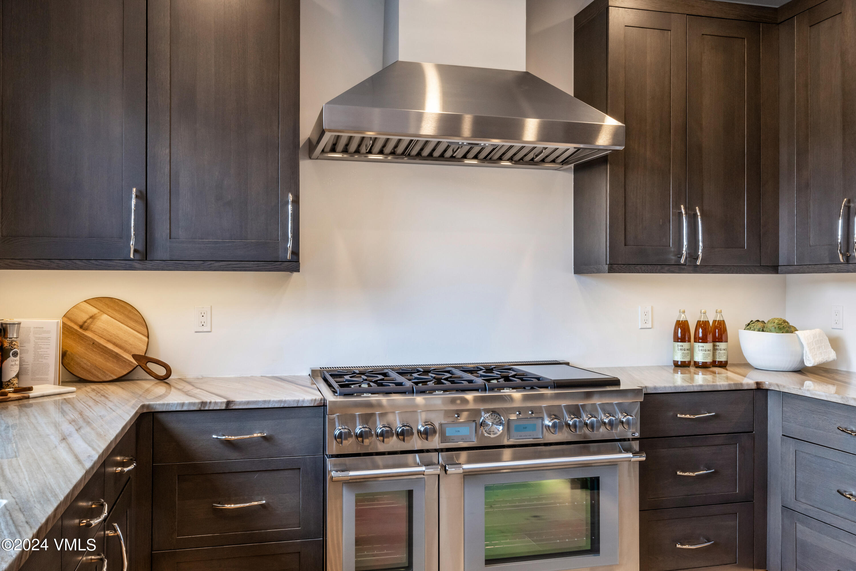 100 Goldfinch Lane, Unit 2B Avon, CO 81620 - Photo 13 of 47 a kitchen with granite countertop a stove and a sink