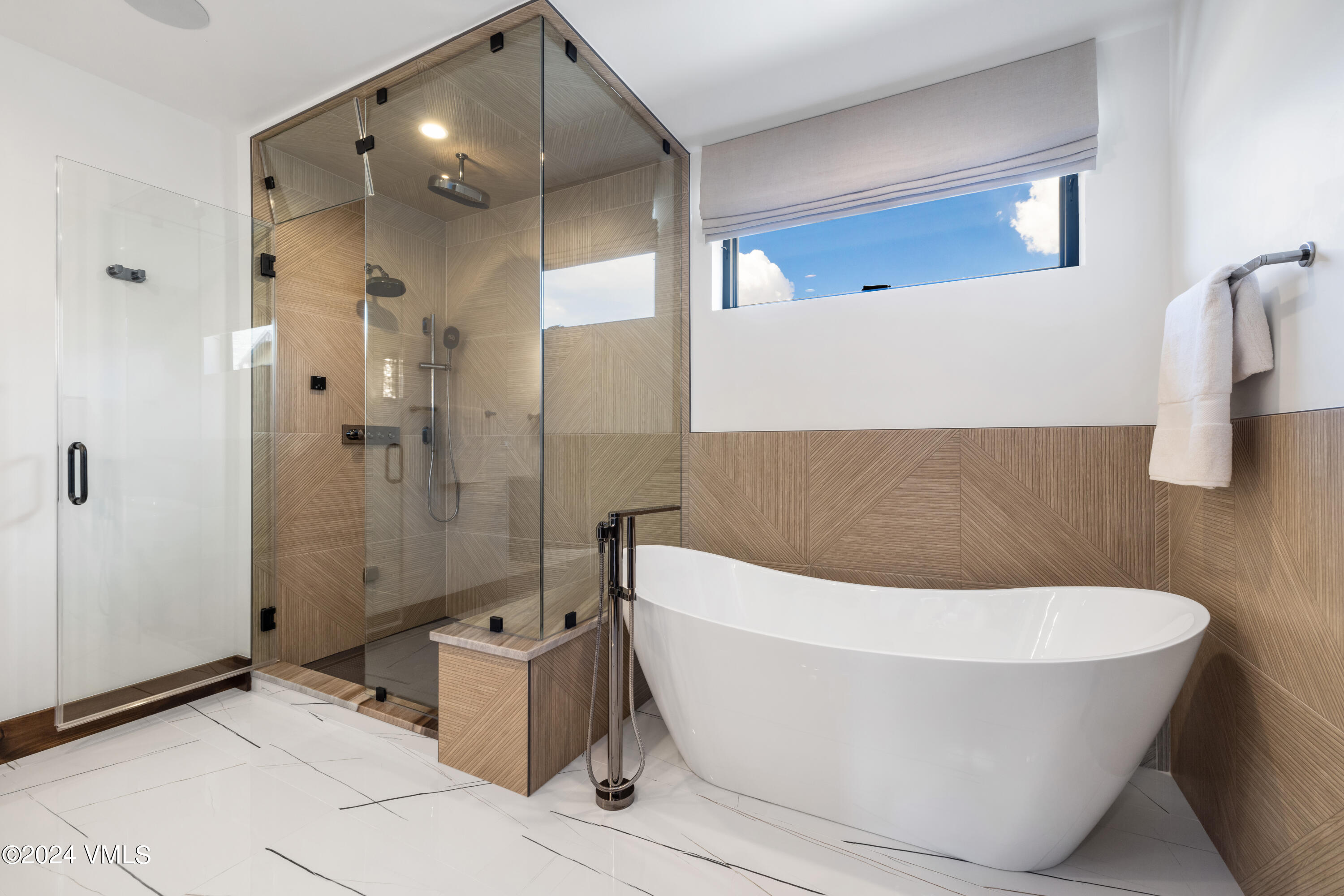 100 Goldfinch Lane, Unit 2B Avon, CO 81620 - Photo 24 of 47 a bathroom with a bathtub and shower