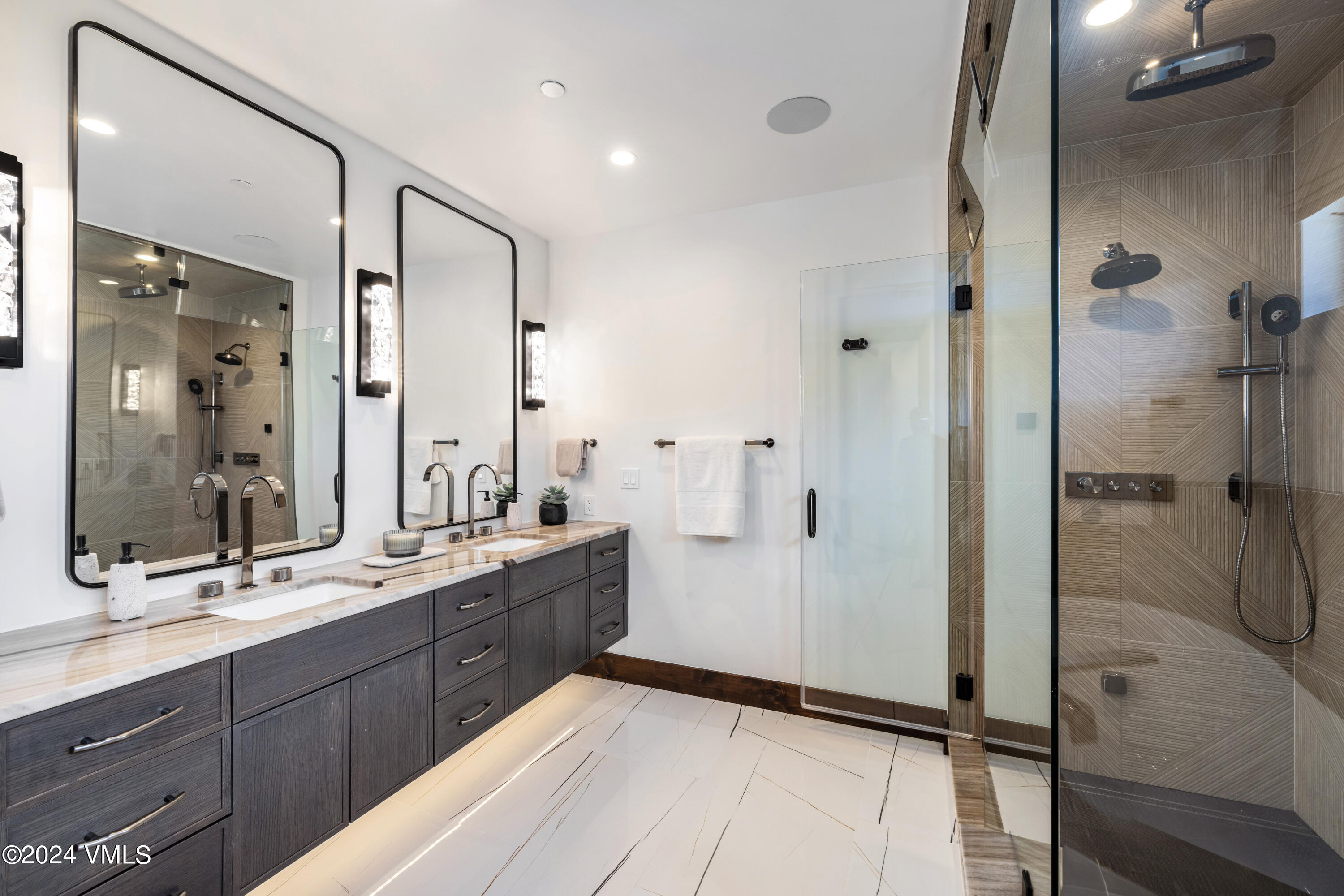 100 Goldfinch Lane, Unit 2B Avon, CO 81620 - Photo 25 of 47 a bathroom with a double vanity sink mirror double and shower