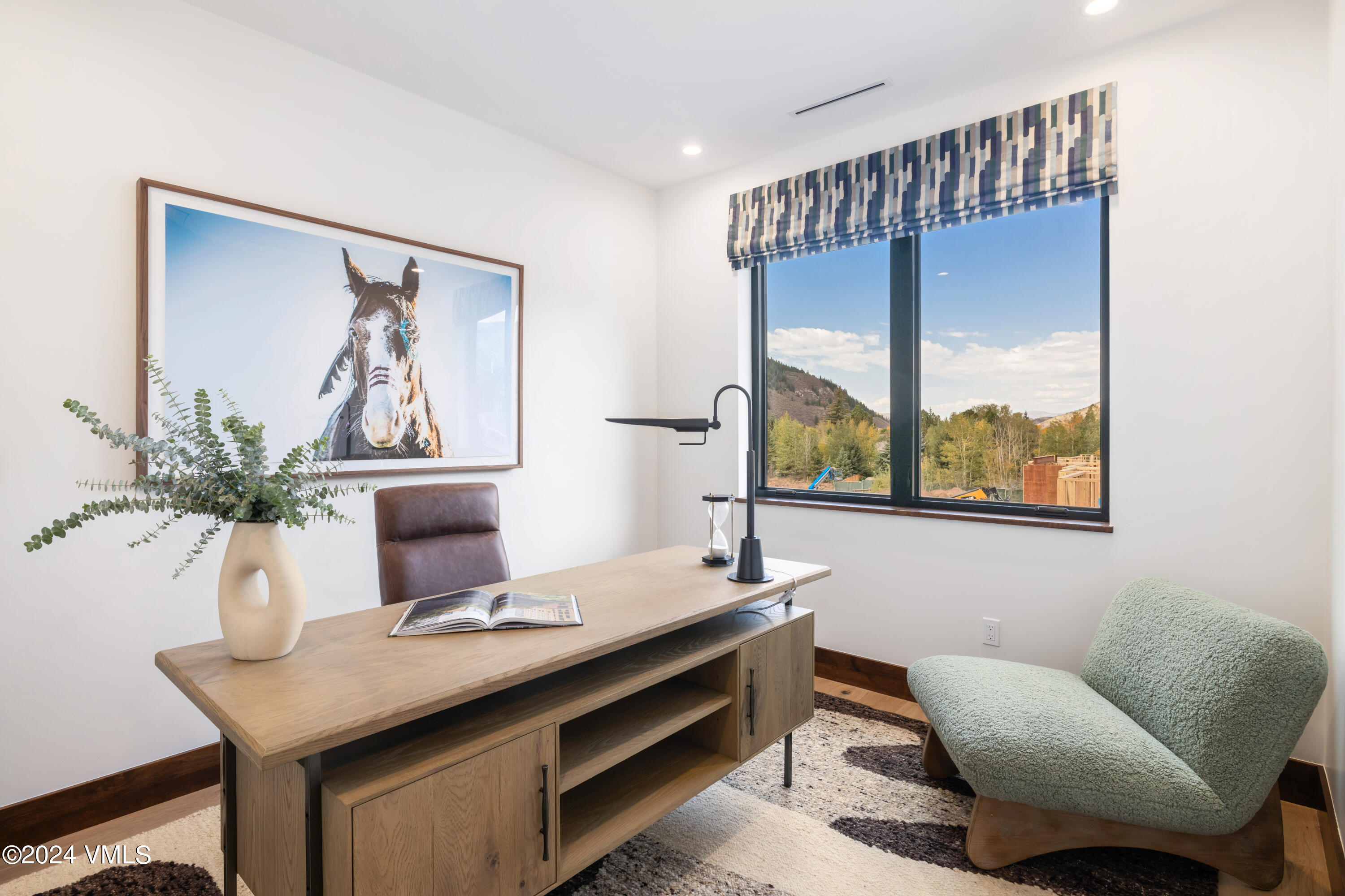 100 Goldfinch Lane, Unit 2B Avon, CO 81620 - Photo 28 of 47 a living room with furniture and window